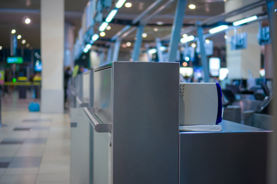 Empty check-in desks with computers in airport