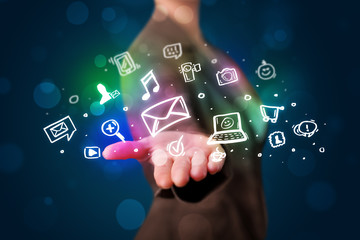 Young woman presenting colorful social media icons © ra2 studio