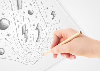 Hand drawing abstract sketches and doodles on paper