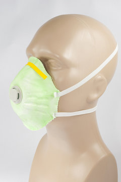 plastic mannequin wearing Protective Dust Mask with valve