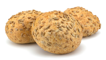Round sandwich bun with sunflower seeds isolated on white backgr
