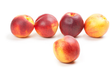 Ripe peaches fruits isolated on white