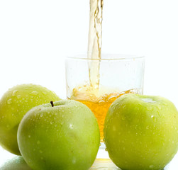 Apple juice with green apples on white background