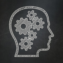 Education concept: Head With Gears on chalkboard background