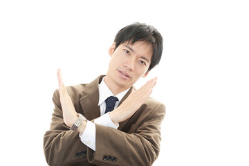 禁止の意思表示をする男性