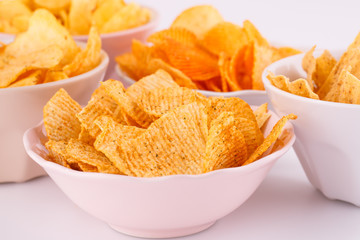 Potato and wheat chips in bowls