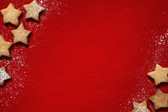 Christmas abstract background with cookies on red fabric