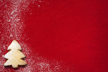Christmas abstract background with cookies on red fabric - obrazy, fototapety, plakaty