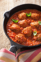 meatballs with tomato sauce in black pan