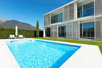 Modern villa with pool, view from the garden