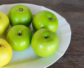 Green and Yellow Apples in Plate