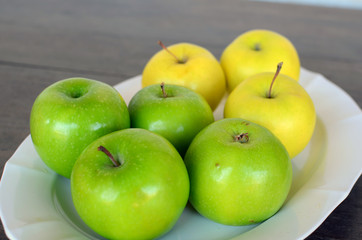 Green and Yellow Apples in Plate