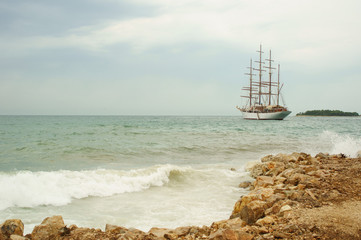 old sailing boat at rippled sea