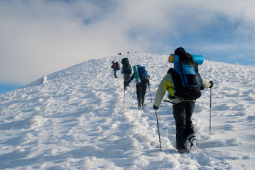 hikers in a winter mountain