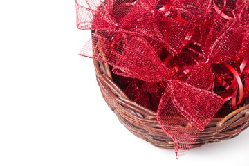 Obraz premium Red christmas ribbons in wicker basket