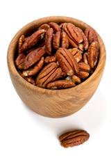pecan nuts in a wooden bowl