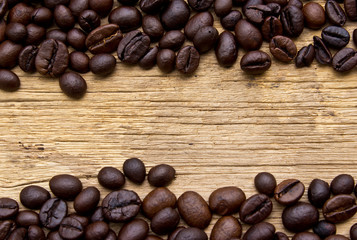 Fresh coffee beans on wood, ready to brew delicious coffee