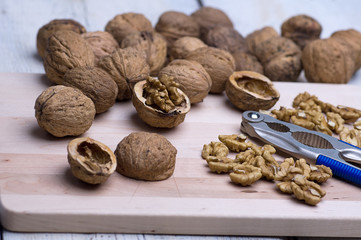 nutcracker and nuts on board, the old table