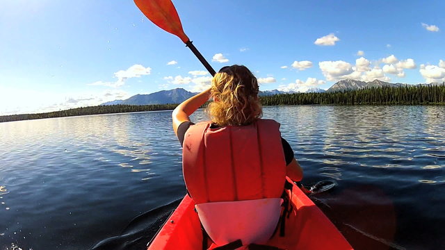 Young female kayaking, USA