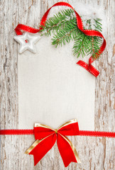 Christmas card with red ribbon, star and fir branch