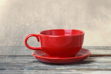 red cup on wooden table