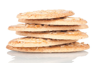 Pile of integral biscuits over a white reflective background