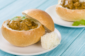 Bunny Chow - South African mutton curry inside a bread bun