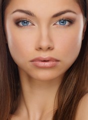 Obraz premium Beautiful young brunette woman with long hair
