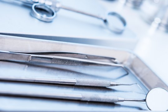 Dental tools and syringe at dentist's surgery