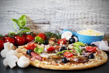 Pizza - Italian pizza with prosciutto and mushrooms