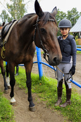 Horse and lovely equestrian girl