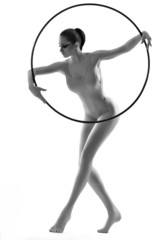 Beautiful young woman gymnast with hula hoop © Pugovica
