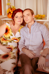 Happy family. plus size pregnant woman