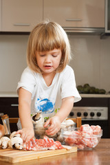 Happy child cooking soap