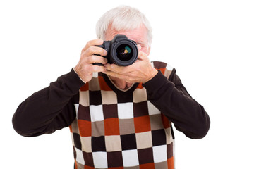 elderly man taking photos