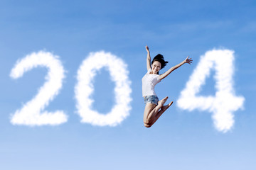 Woman jumping with new year 2014