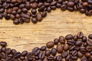 Fresh coffee beans on wood, ready to brew delicious coffee