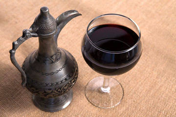 Simple View Of Pewter Flagon and Red Vine in the Glass