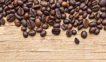 Fresh coffee beans on wood, ready to brew delicious coffee