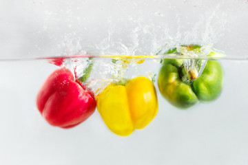 The colorful capsicum or bellpepper in the water