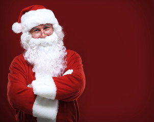 Fototapeta na wymiar Photo of happy Santa Claus in eyeglasses looking at camera