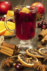 Glass with mulled wine and spices