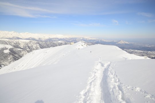 Alpinist on the mountain ridge