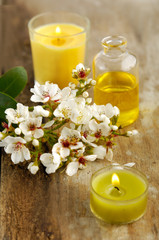 Fototapeta na wymiar Tropical spring flower with massage oil on board