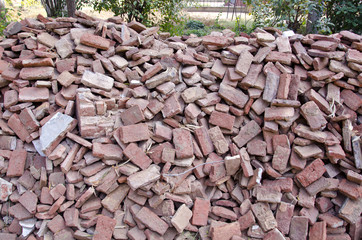 old used red bricks stack in India