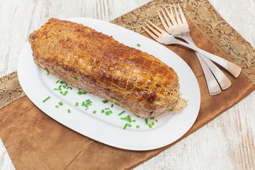 Freshly grilled meat roulade in a frying pan