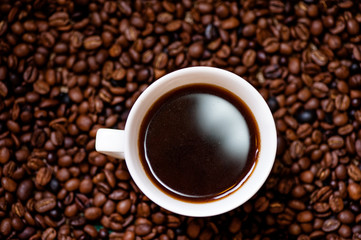 White cup of hot, fresh and aromatic coffee, detail view