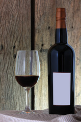 Wine glass and Bottle on wooden background