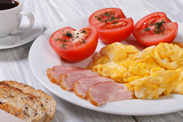 Omelet with ham and tomato and coffee for breakfast