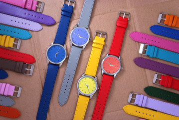 composition of colourful watches on cardboard background - 58253551